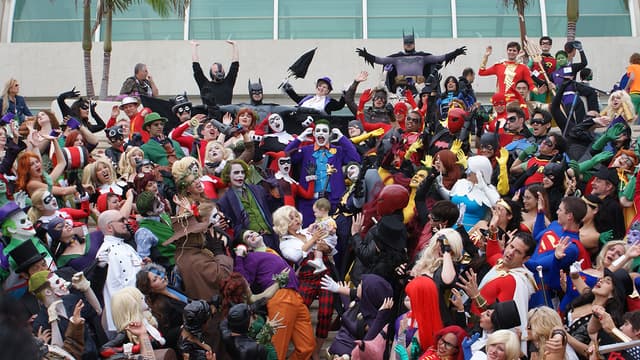 Large group of people dressed as comic characters at Comic-Con 2013.