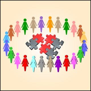 Figures forming a circle around a jigsaw puzzle.