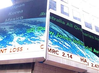 Phot of a billboard displaying a stock ticker.