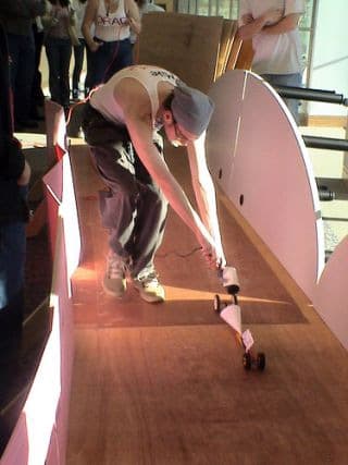 Photograph of a student racing a dragster.
