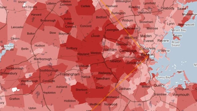 A map of the Greater Boston area, with neighborhoods colored in shades of red. An orange line delineates an arc of favored suburbs stretching west of Boston.