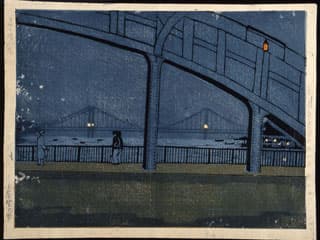 A scene of a bridge at night